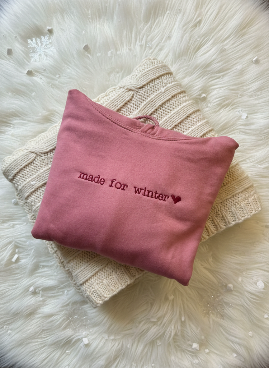 Winter-themed pink hoodie flat lay